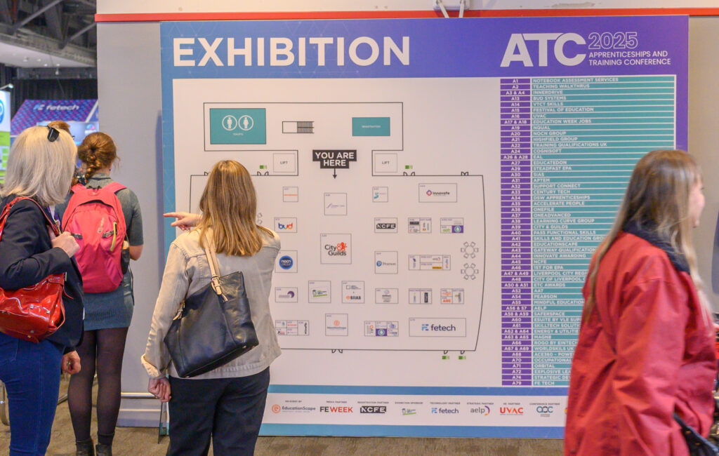 Atc 2025 | apprenticeships and training conference Exhibtion signage at atc - people looking at map